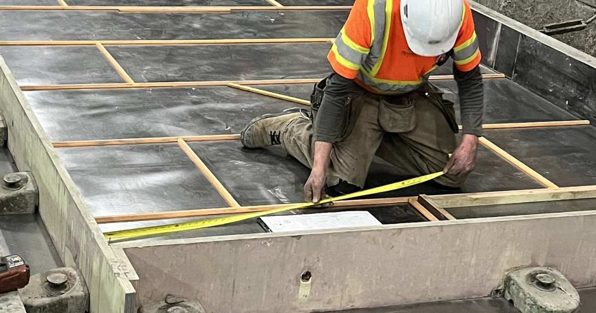 construction worker framing base for concrete 